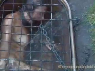 Caged stunner forced to give blowjob